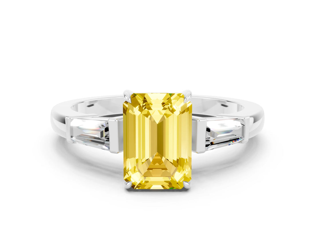 White gold Emerald Cut Cut Diamond Ring with Tapered Baguette Side Stones in Four-Prong Setting
