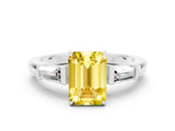 White gold Emerald Cut Cut Diamond Ring with Tapered Baguette Side Stones in Four-Prong Setting