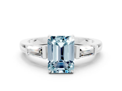White gold Emerald Cut Cut Diamond Ring with Tapered Baguette Side Stones in Four-Prong Setting