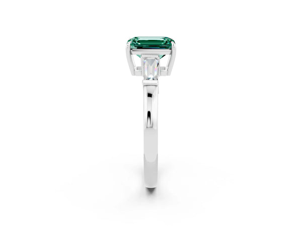 Platinum Emerald Cut Green Sapphire Three-Stone Ring with Tapered Baguette Side Stones and Prong Setting