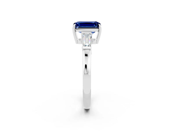 Platinum Emerald Cut Blue Sapphire Three-Stone Ring with Tapered Baguette Side Stones and Prong Setting