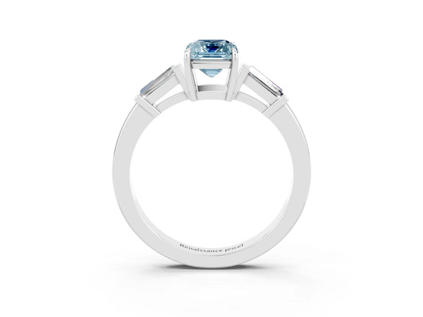 Platinum Emerald Cut Aquamarine Three-Stone Ring with Tapered Baguette Side Stones and Prong Setting