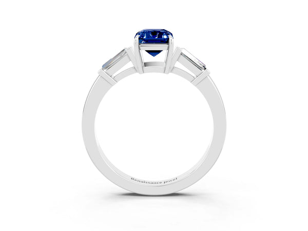 White gold Emerald Cut Blue Sapphire Three-Stone Ring with Tapered Baguette Side Stones and Prong Setting