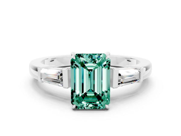 Platinum Emerald Cut Green Sapphire Three-Stone Ring with Tapered Baguette Side Stones and Prong Setting