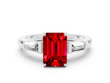 White gold Emerald Cut Cut Diamond Ring with Tapered Baguette Side Stones in Four-Prong Setting