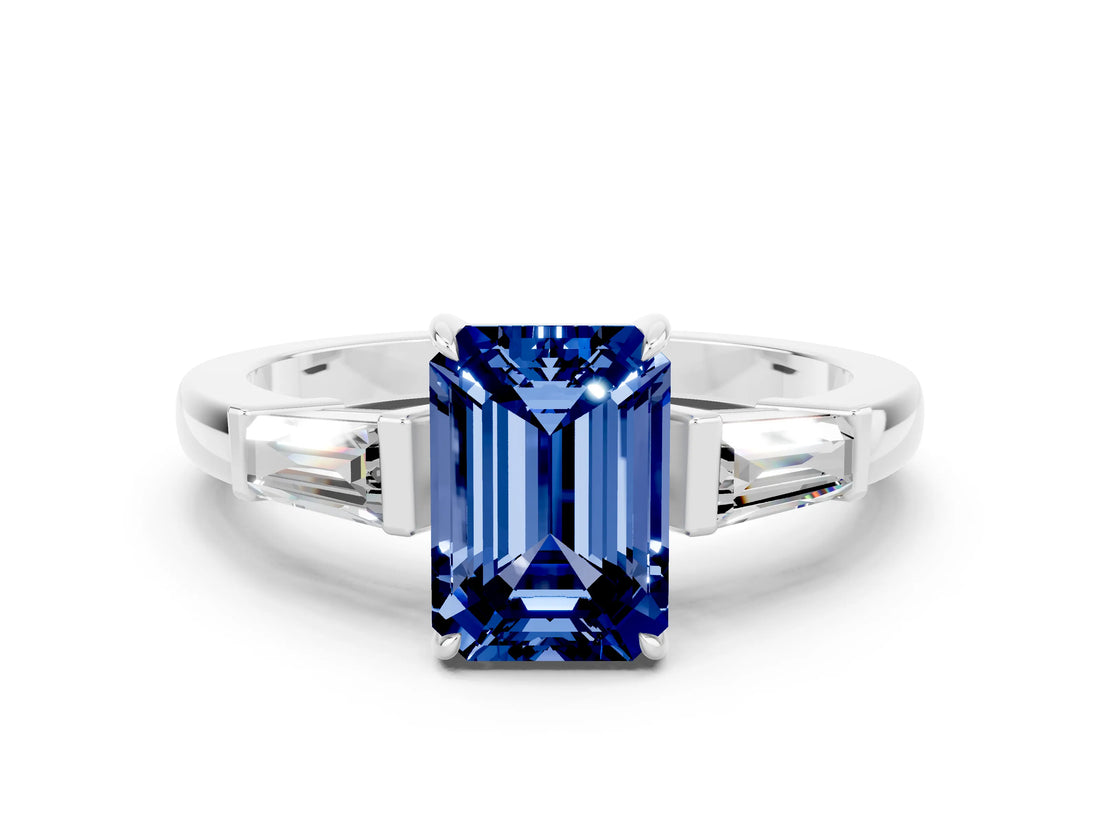 White gold Emerald Cut Cut Diamond Ring with Tapered Baguette Side Stones in Four-Prong Setting