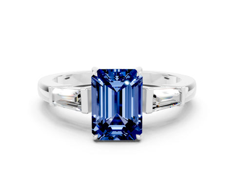 White gold Emerald Cut Cut Diamond Ring with Tapered Baguette Side Stones in Four-Prong Setting