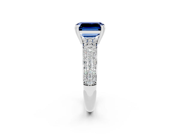 Platinum Emerald Cut Blue Sapphire Solitaire Ring with Multi-Row Round Pavé Band and Prong Setting