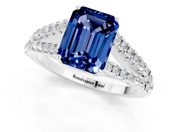 Platinum Emerald Cut Blue Sapphire Split Shank Engagement Ring with Round Pavé and Prong Setting