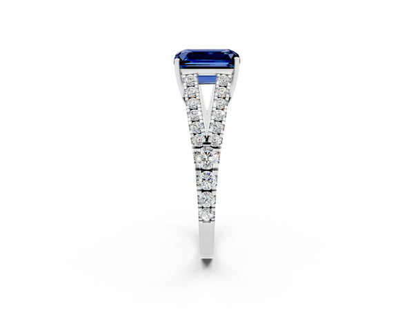 Platinum Emerald Cut Blue Sapphire Split Shank Engagement Ring with Round Pavé and Prong Setting