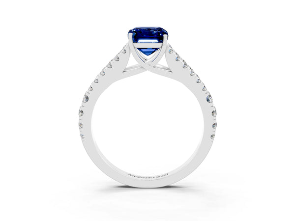 White gold Emerald Cut Blue Sapphire Split Shank Engagement Ring with Round Pavé and Prong Setting