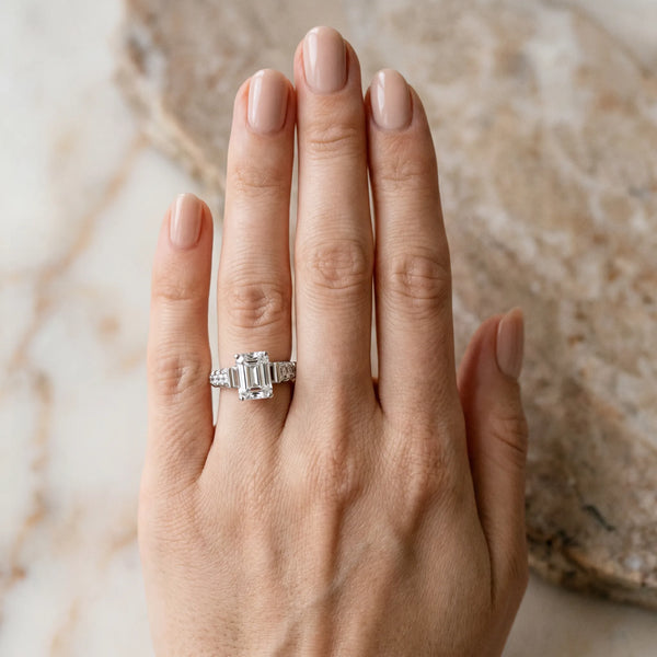 White gold Emerald Cut Diamond Classic Solitaire Ring with Pavé Band and Four-Prong Setting