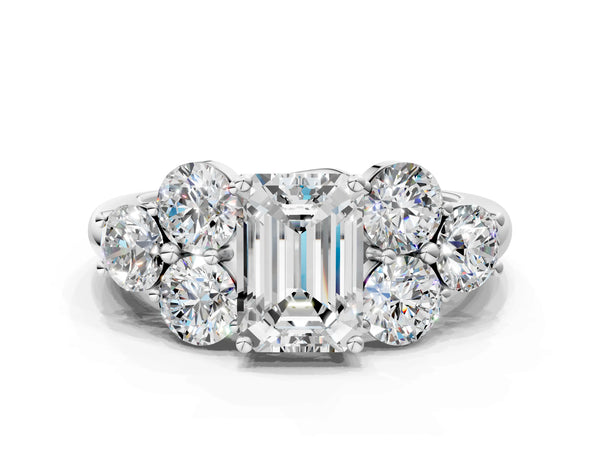 White gold Emerald Cut Diamond Cluster Ring with Round Accent Stones and Prong Setting on a Classic Band