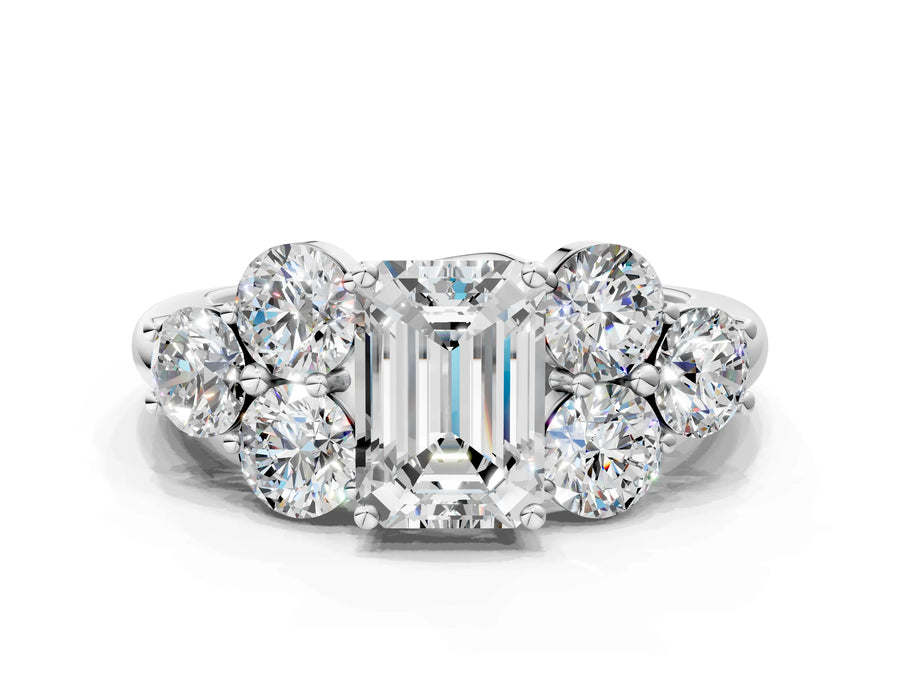 White gold Emerald Cut Diamond Cluster Ring with Round Accent Stones and Prong Setting on a Classic Band