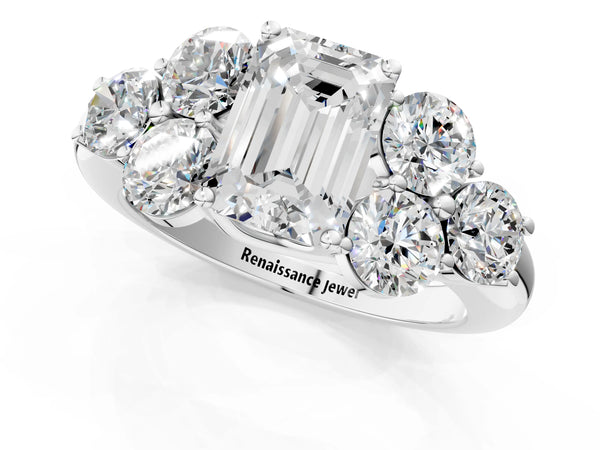 White gold Emerald Cut Diamond Cluster Ring with Round Accent Stones and Prong Setting on a Classic Band