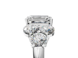White gold Emerald Cut Diamond Cluster Ring with Round Accent Stones and Prong Setting on a Classic Band_83