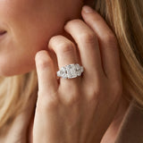 White gold Emerald Cut Diamond Cluster Ring with Round Accent Stones and Prong Setting on a Classic Band_93