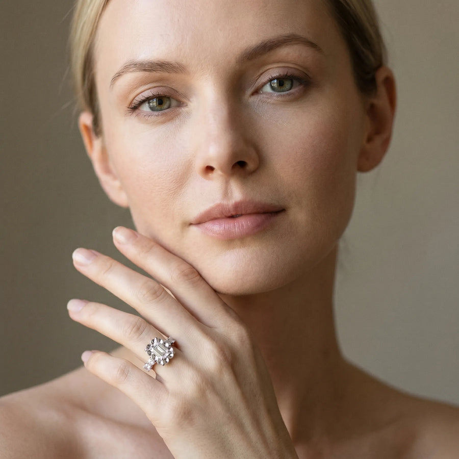 White gold Emerald Cut Diamond Floral Halo Engagement Ring with Shared Prong Setting