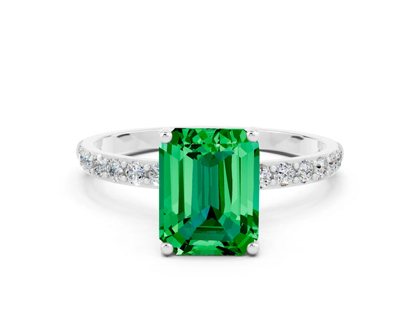 Platinum Emerald Cut Emerald Solitaire Ring with Round Pavé Shoulders and Prong Setting