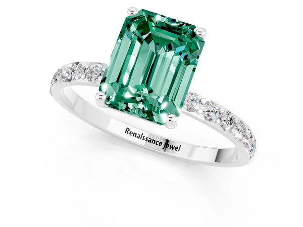 Platinum Emerald Cut Green Sapphire Solitaire Ring with Round Pavé Shoulders and Prong Setting