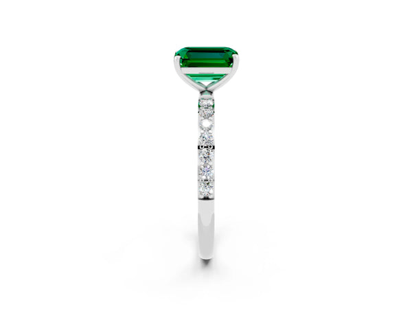Platinum Emerald Cut Emerald Solitaire Ring with Round Pavé Shoulders and Prong Setting