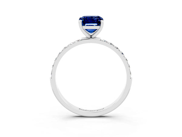 Silver Emerald Cut Blue Sapphire Solitaire Ring with Round Pavé Shoulders and Prong Setting