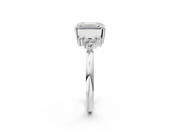 White gold Emerald Cut Diamond Ring with Side Stones and Four-Prong Setting