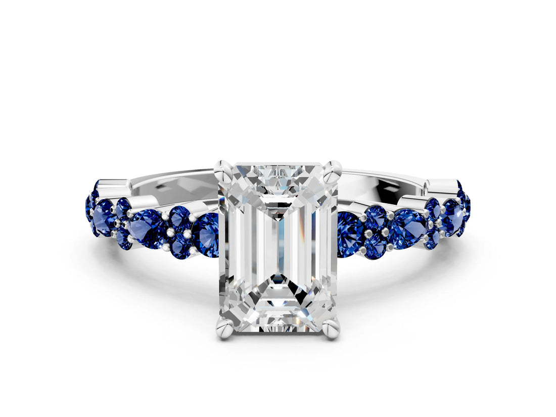 White gold Emerald Cut Diamond Side Stone Solitaire Ring with Round with Blue Sapphire side stone and Four-Prong Setting