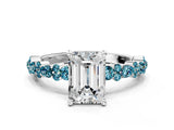 White gold Emerald Cut Diamond Side Stone Solitaire Ring with Round with Blue Topaz side stone and Four-Prong Setting