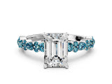 White gold Emerald Cut Diamond Side Stone Solitaire Ring with Round with Blue Topaz side stone and Four-Prong Setting