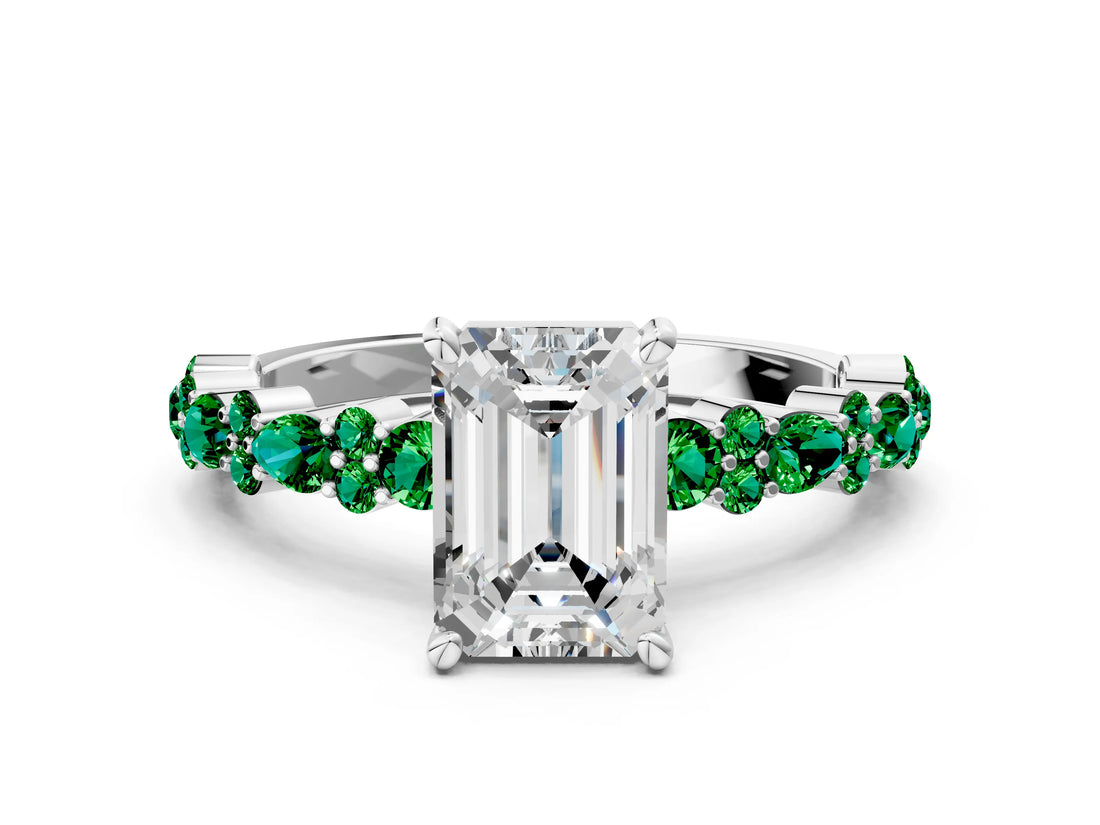 White gold Emerald Cut Diamond Side Stone Solitaire Ring with Round with Emerald side stone and Four-Prong Setting
