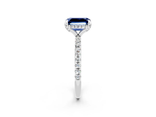 White gold Emerald Cut Blue Sapphire Hidden Halo Engagement Ring with Round Pavé Band and Prong Setting