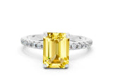 White gold Emerald Cut Diamond Solitaire Ring with Four-Prong Setting and Pavé Band