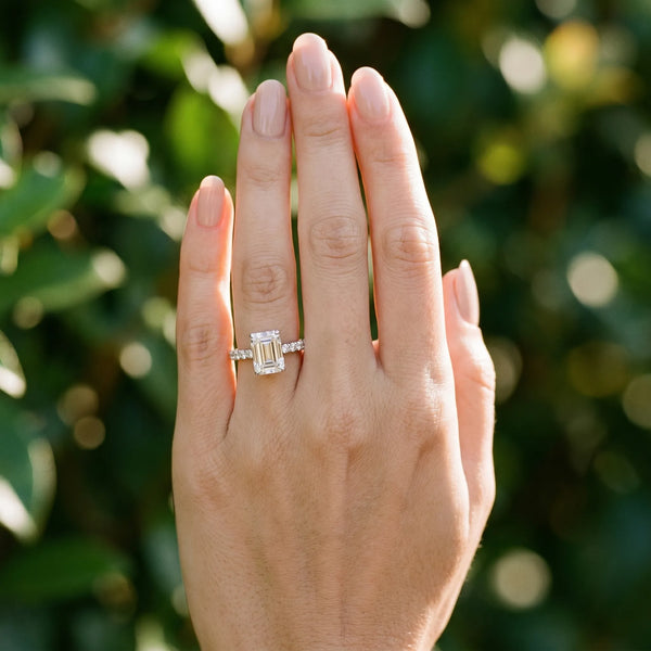 White gold Emerald Cut Diamond Solitaire Ring with Pavé Accents and Four-Prong Setting