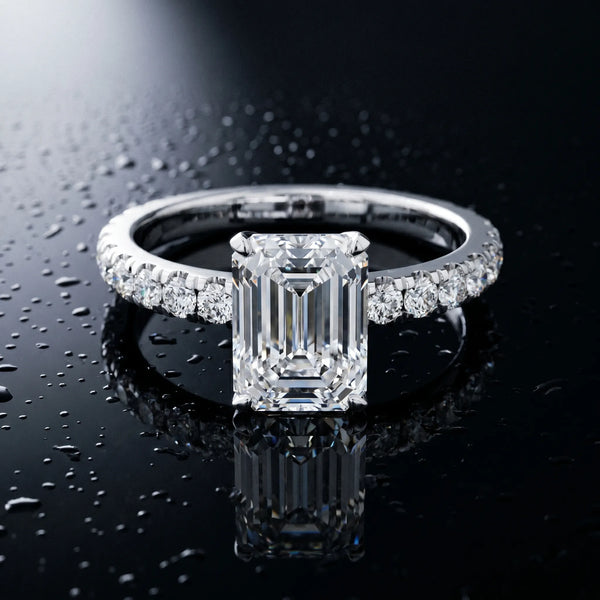 White gold Emerald Cut Diamond Solitaire Ring with Pavé Accents and Four-Prong Setting