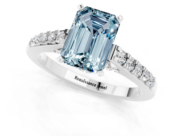 Platinum Emerald Cut Aquamarine Solitaire Ring with Crossover Gallery and Round  Pavé Band