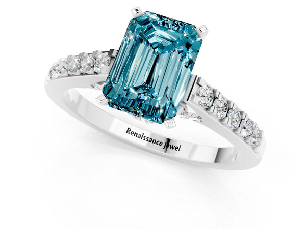 Platinum Emerald Cut Blue Topaz Solitaire Ring with Crossover Gallery and Round  Pavé Band