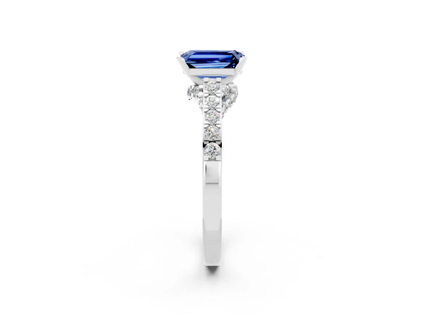 White gold Emerald Cut Blue Sapphire Solitaire Ring with Crossover Gallery and Round  Pavé Band
