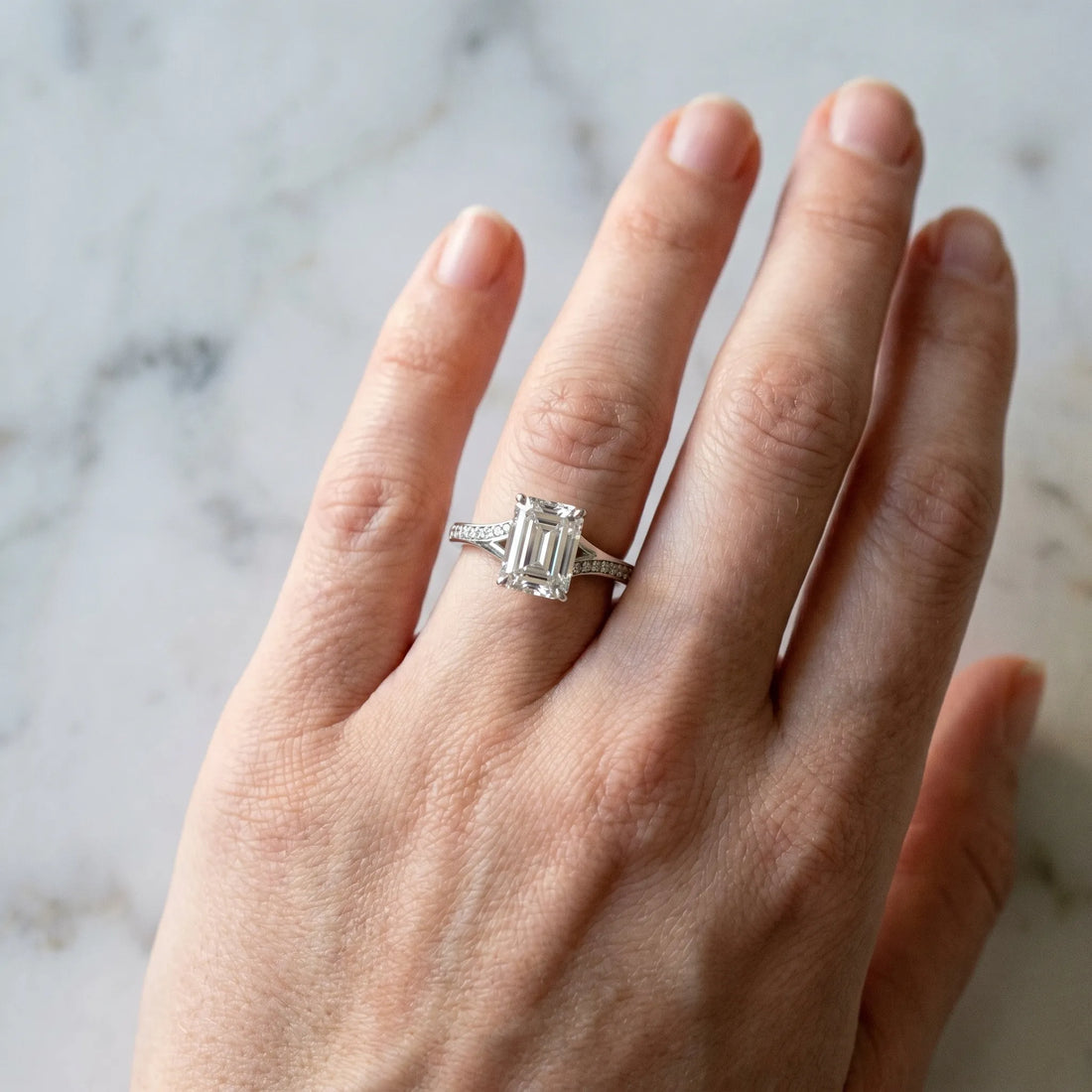 White gold Emerald Cut Diamond Solitaire Ring with Pavé Band and Prong Setting_97