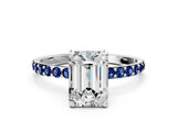White gold Emerald Cut Diamond Solitaire Ring with Round with Blue Sapphire side stone Pavé Band and Prong Setting_24