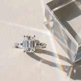 White gold Emerald Cut Diamond Solitaire Ring with Side Stones and Four-Prong Setting_432