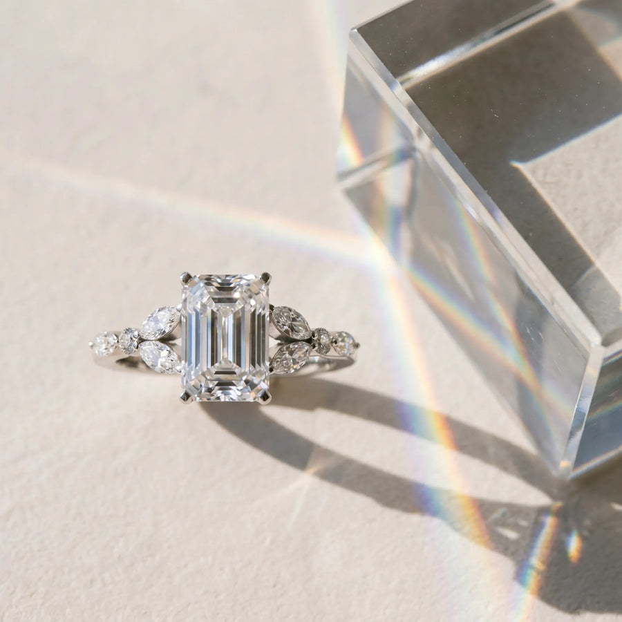 White gold Emerald Cut Diamond Solitaire Ring with Side Stones and Four-Prong Setting