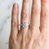 White gold Emerald Cut Diamond Solitaire Ring with Tapered Baguette Accents and Four-Prong Setting_159