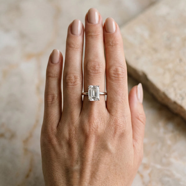 White gold Emerald Cut Diamond Solitaire Ring with Thin Band and Four-Prong Setting
