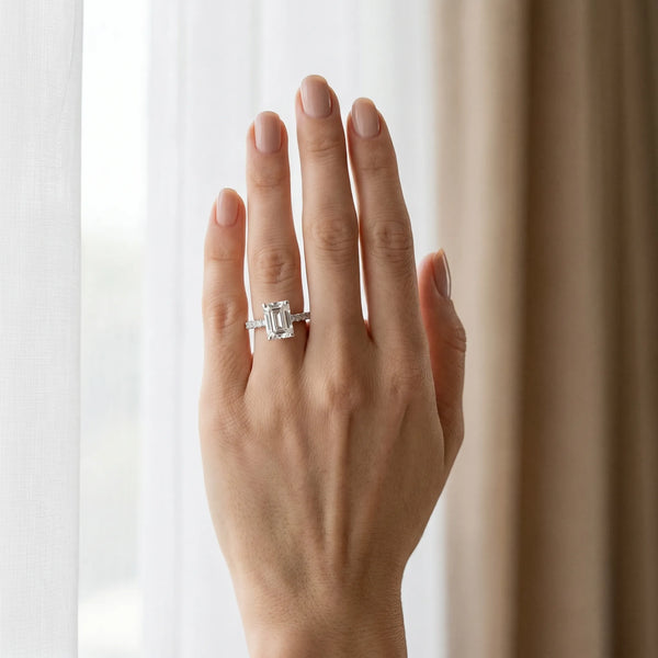 White gold Emerald Cut Diamond Solitaire with Pave Band and Four-Prong Setting