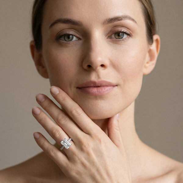 White gold Emerald Cut Diamond Solitaire with Pave Band and Four-Prong Setting