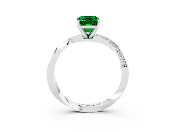Silver Emerald Cut Emerald Engagement Ring with Side Stone Accents and Four-Prong Setting