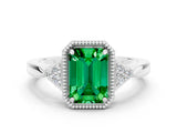 White gold Emerald Cut Emerald Halo Ring with Tapered Band and Four-Prong Setting