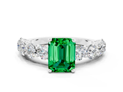 White gold Emerald Cut Emerald Prong Setting with Side Stones on a Pave Band
