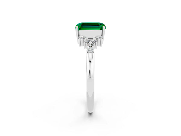 Silver Emerald Cut Emerald Ring with Side Stones and Four-Prong Setting